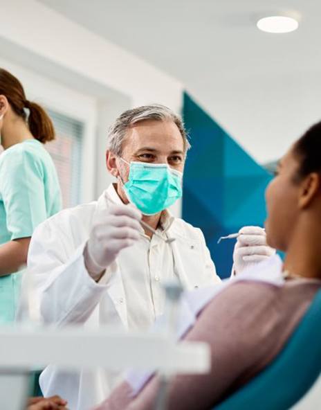 Dentist treats patient