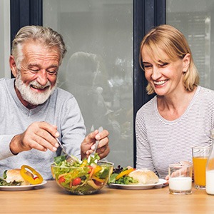 Couple eating healthy foods for dinner