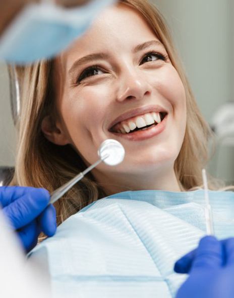 Lady smiles at dentist