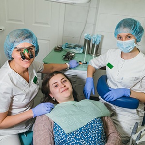 Lady smiles after dental treatment