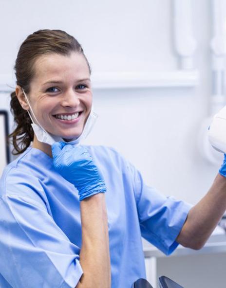 Dentist treats patient